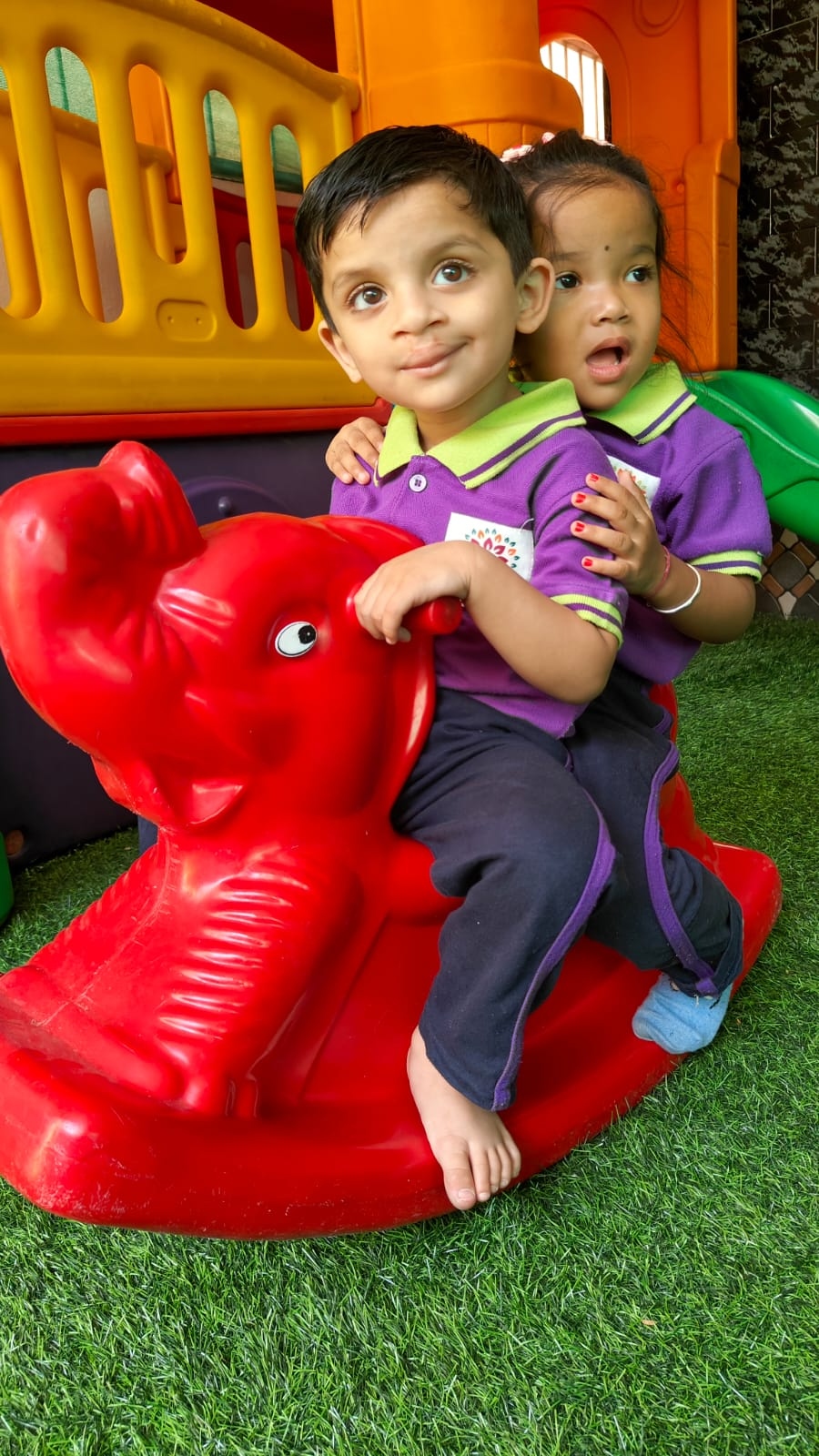 Children on rocking elephant